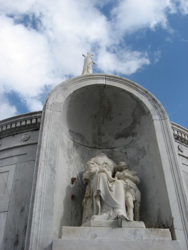 Broken statues on the central tomb